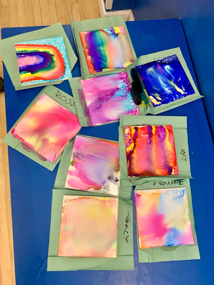 Colorful artwork pieces displayed on table